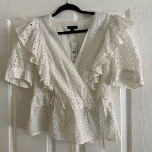 White eyelet top with puff sleeves and side tie